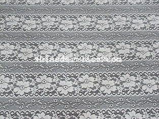 China Tela delicada del encaje elástico del espaciamiento de la estriación de la flor con el material de nylon de Spandex para el vestido SYD-0173 proveedor