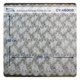 Tela nupcial de teñido normal afilada horneada a la crema y con pan rallado floral de marfil de nylon del cordón del vestido proveedor